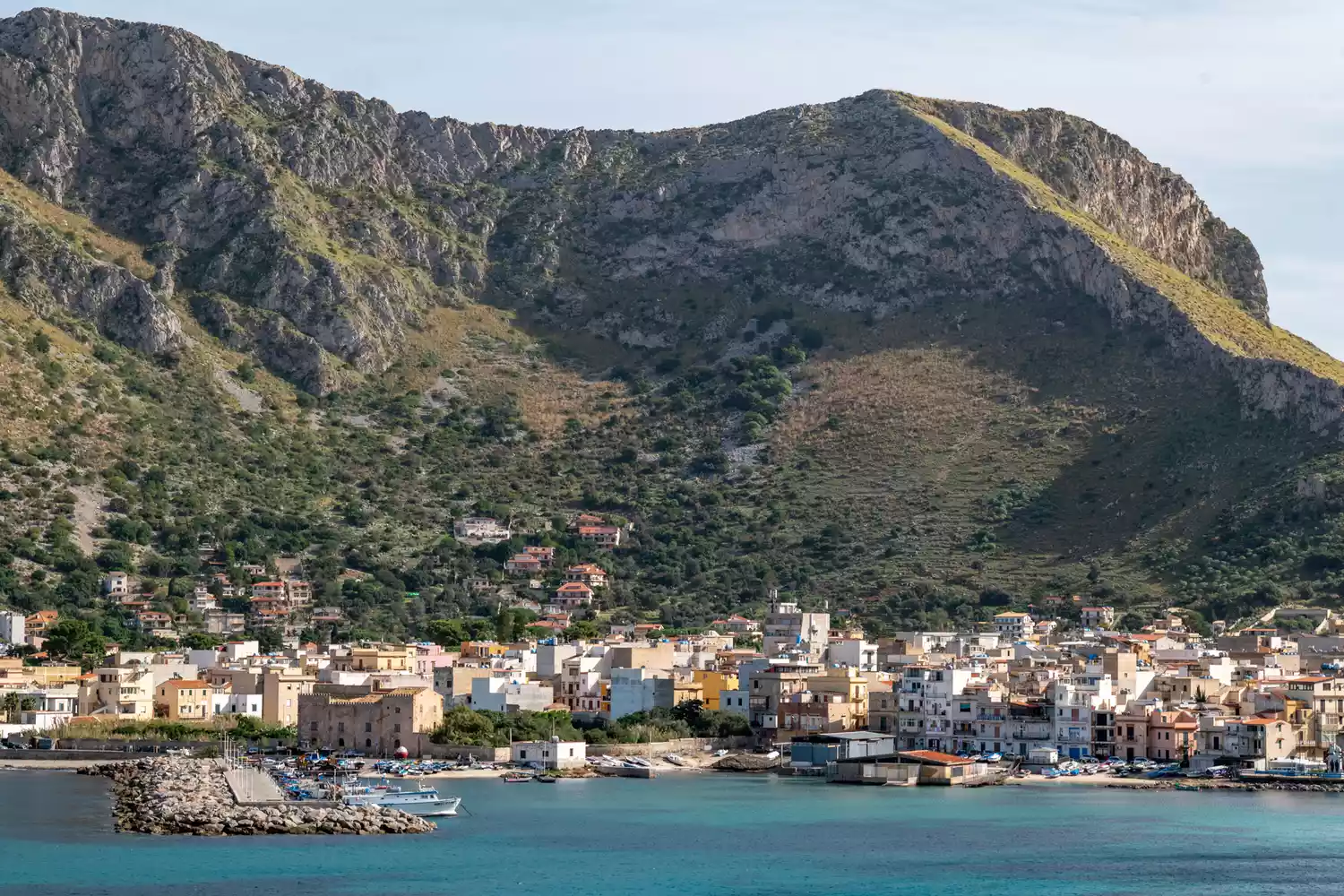 Wide landscape shot of the Palermo coastline and blue Mediterranean water.
