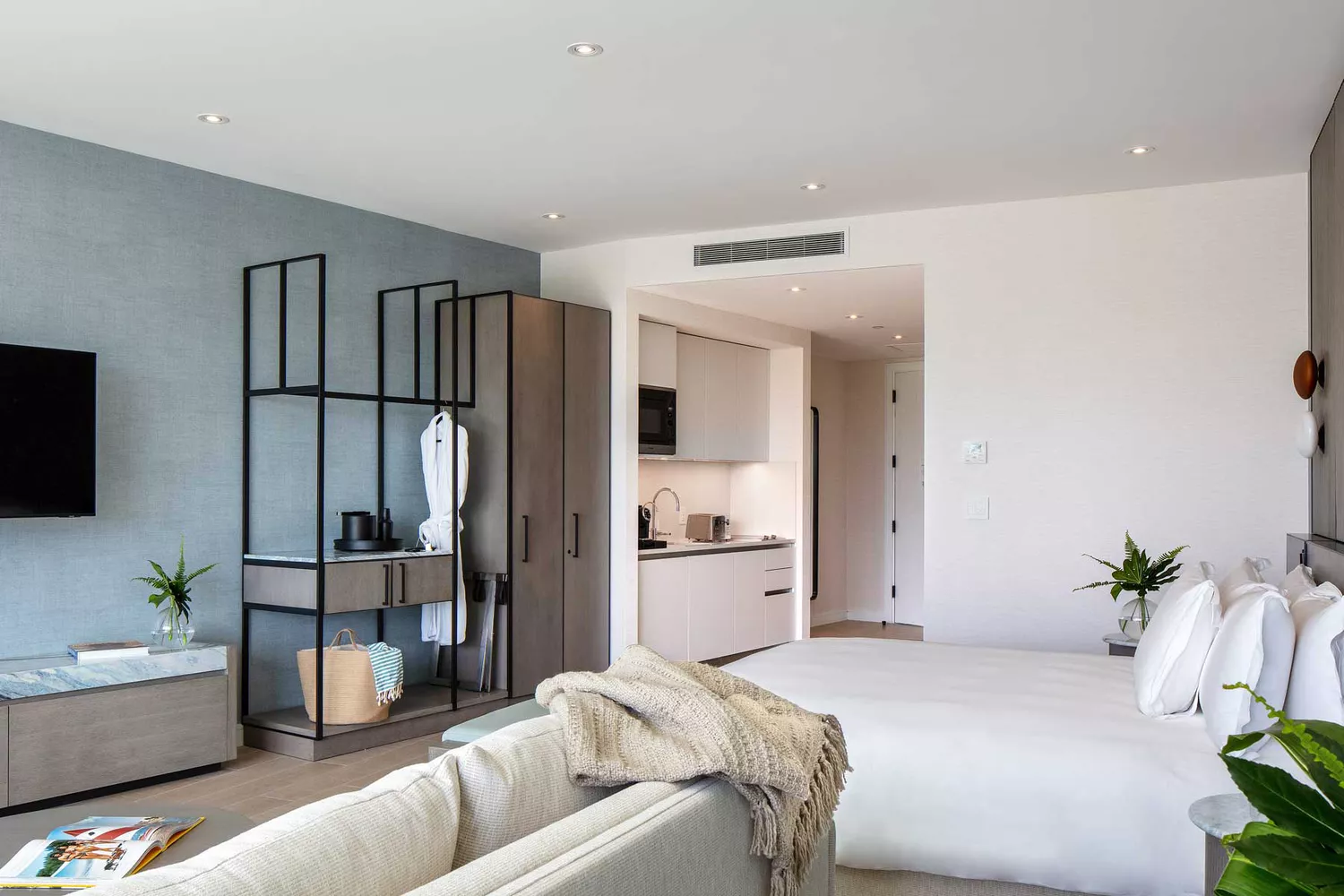 Interior of a studio guest room at Goldwynn Resort featuring midcentury modern decor.