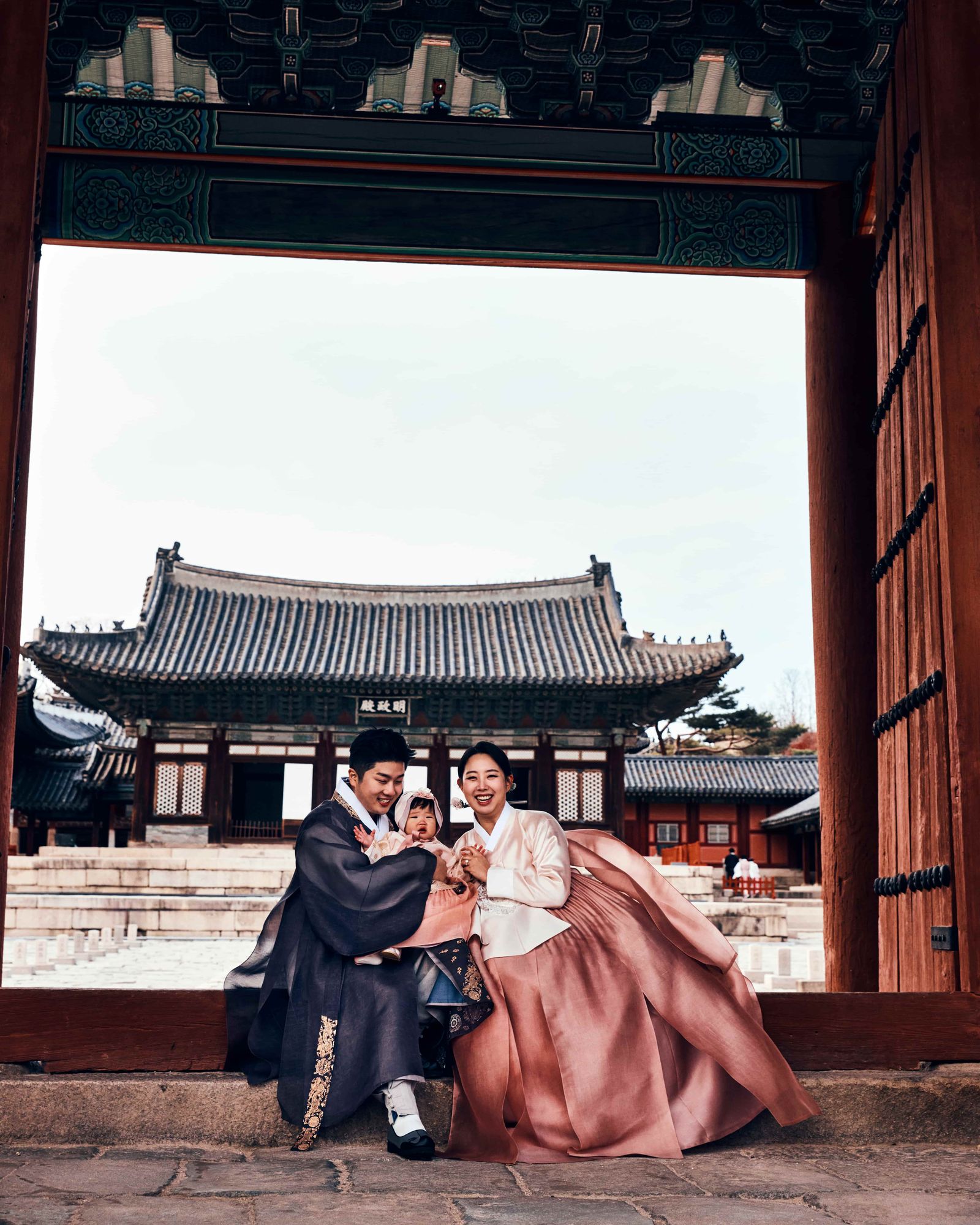 Traditional Bukchon Hanok Village alleyway with historic architecture and visitors.
