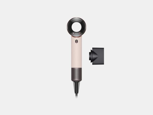 A modern, compact dual voltage hair dryer with precision styling attachments.