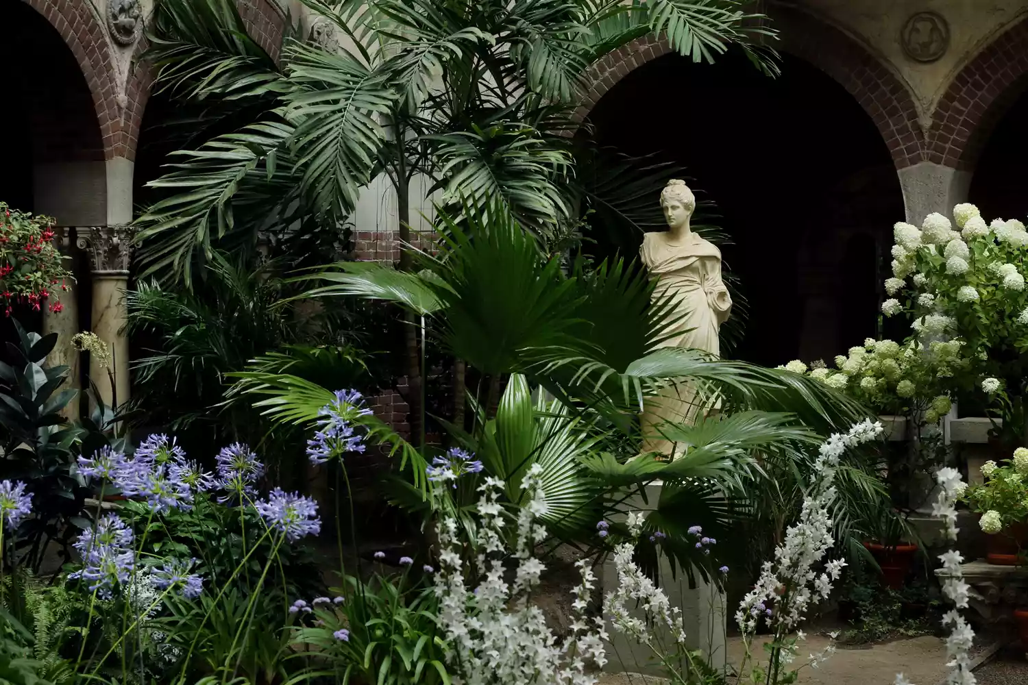 The ornate, plant-filled courtyard of the Isabella Stewart Gardner Museum.