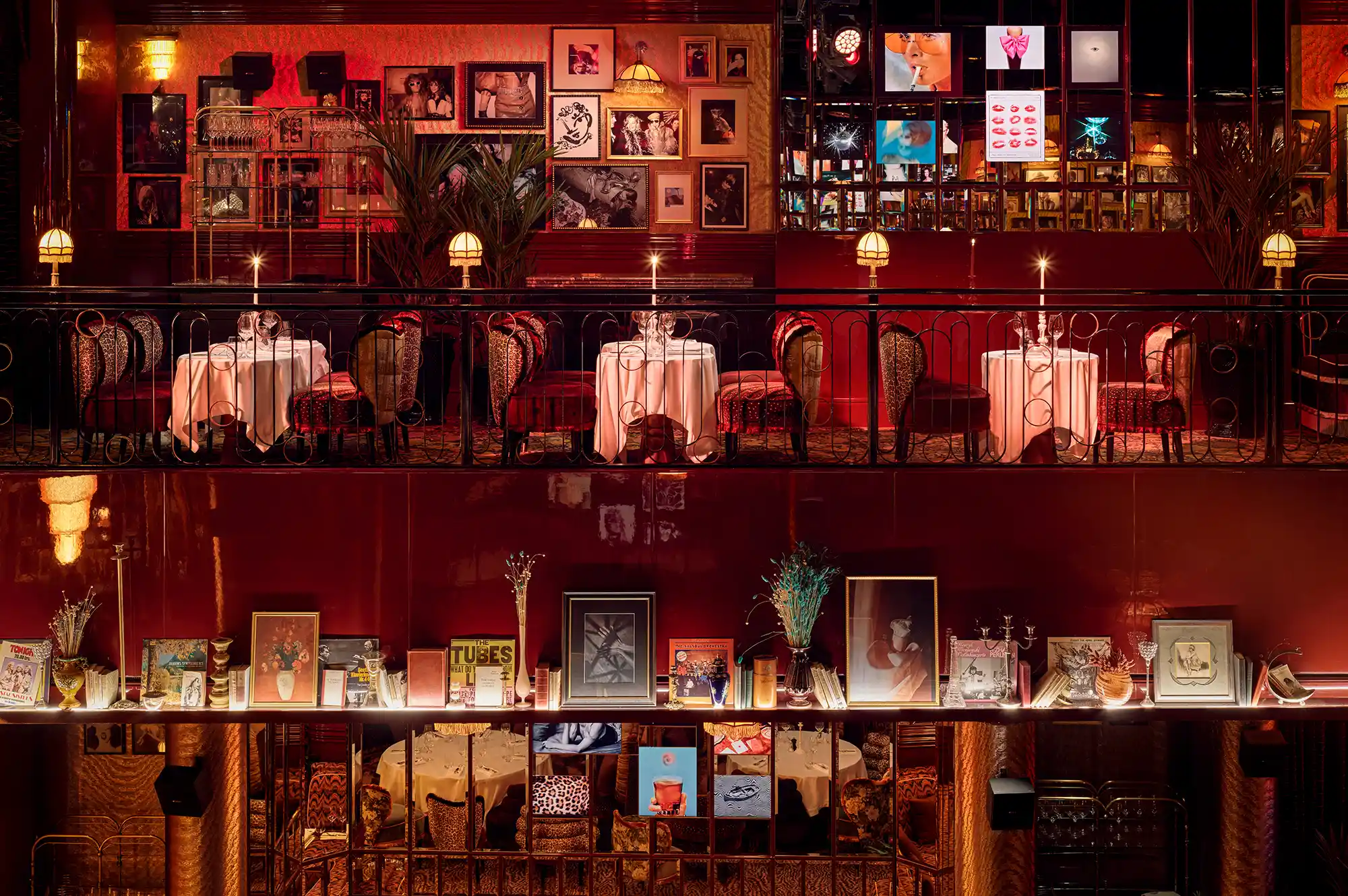 Interiors of Mondaine de Pariso restaurant featuring gallery-style walls and elegant tablescapes.