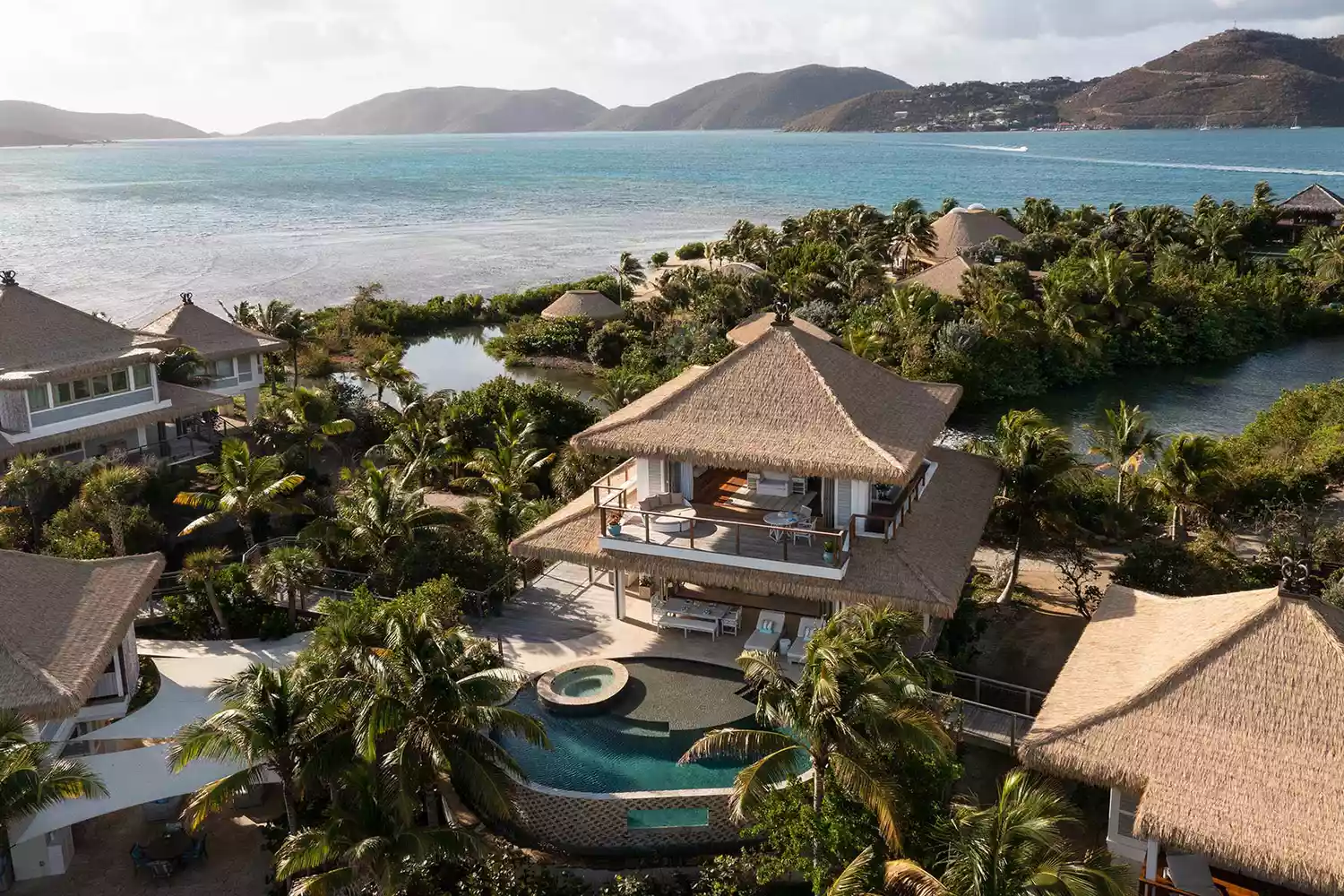 Secluded beachfront villa at Moskito Island with modern wooden architecture and direct sand access.