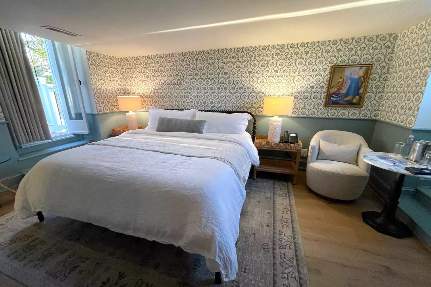 A wide-angle view of a boutique guest room at Blue Rock featuring clean lines and warm accents.