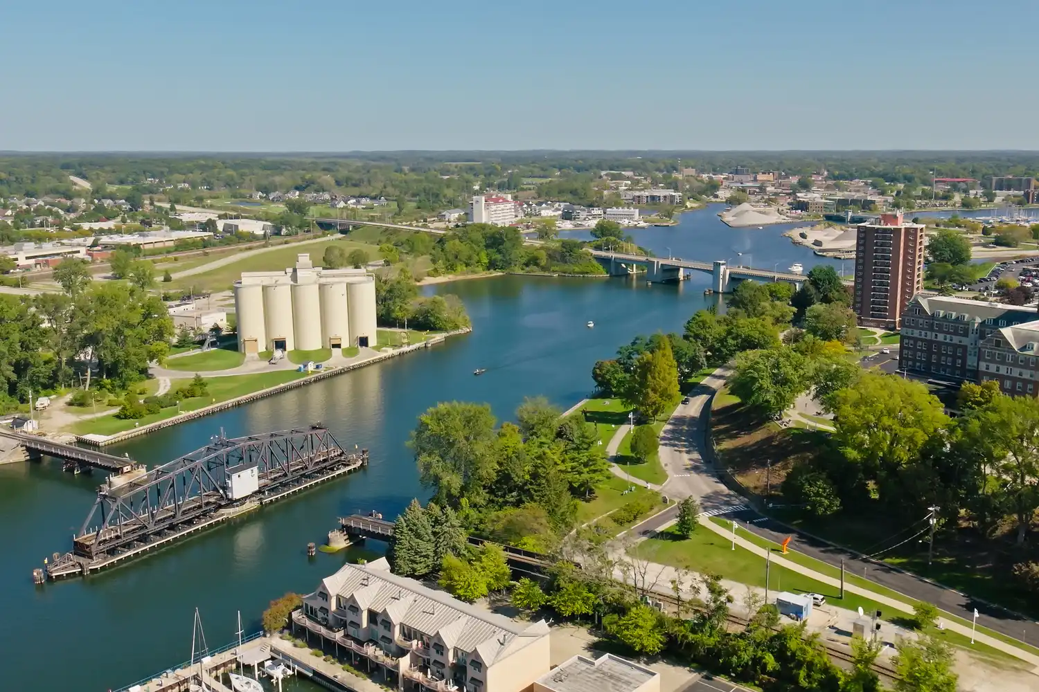 Aerial overview of a river outlet in St. Joseph, Michigan with boats and marina.