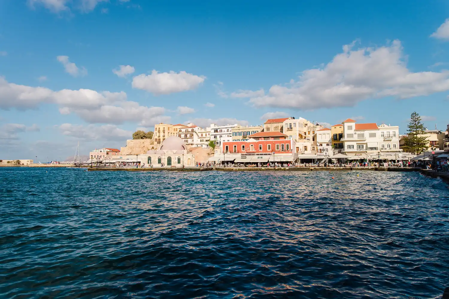 A view of the historic harbor and buildings in Chania, Crete.