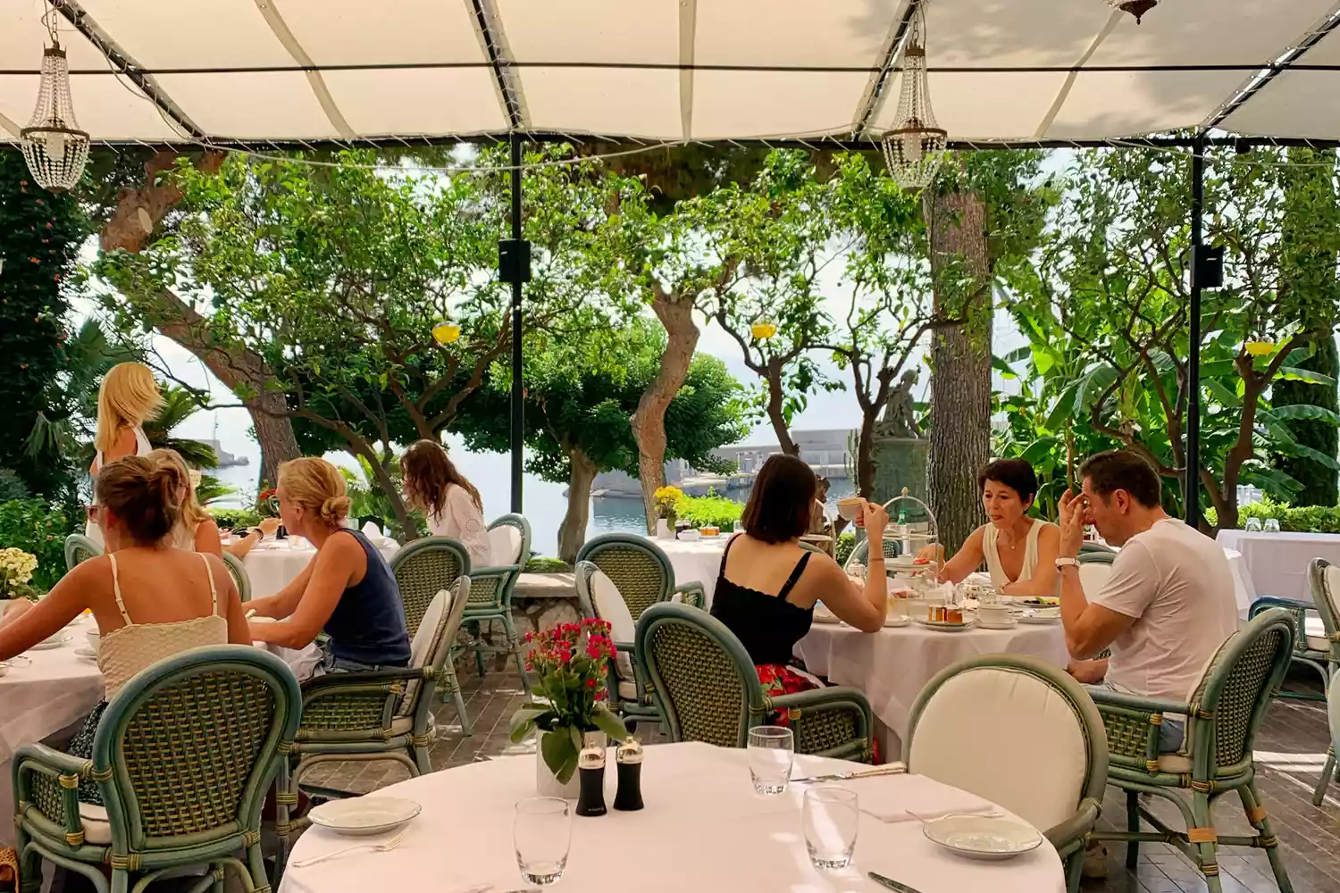 Diners enjoying a meal at the elegant Florio restaurant at Villa Igiea.