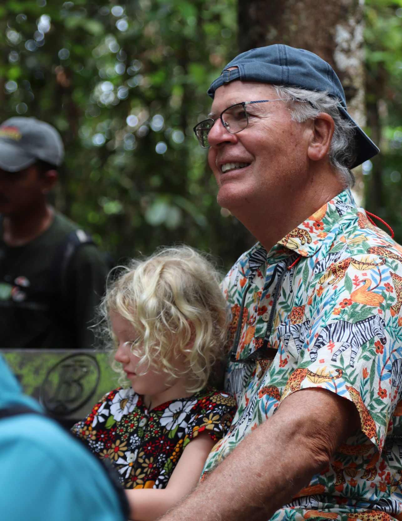 A happy child and senior smiling together during a vacation.