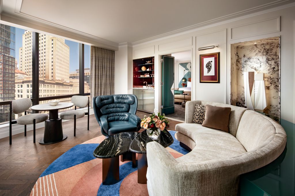 A contemporary and refined luxury hotel room with high-end furniture and soft lighting.