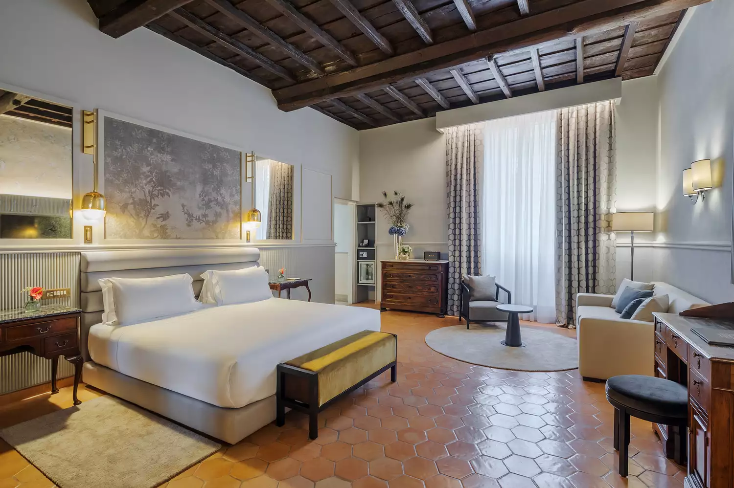 Elegant interior of the Borromini Suite featuring historic structural elements and modern furnishings.