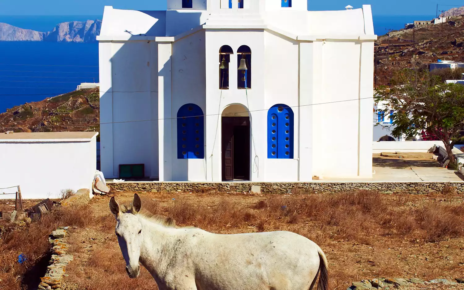Traditional whitewashed buildings and narrow paths in Folegandros, Greece.