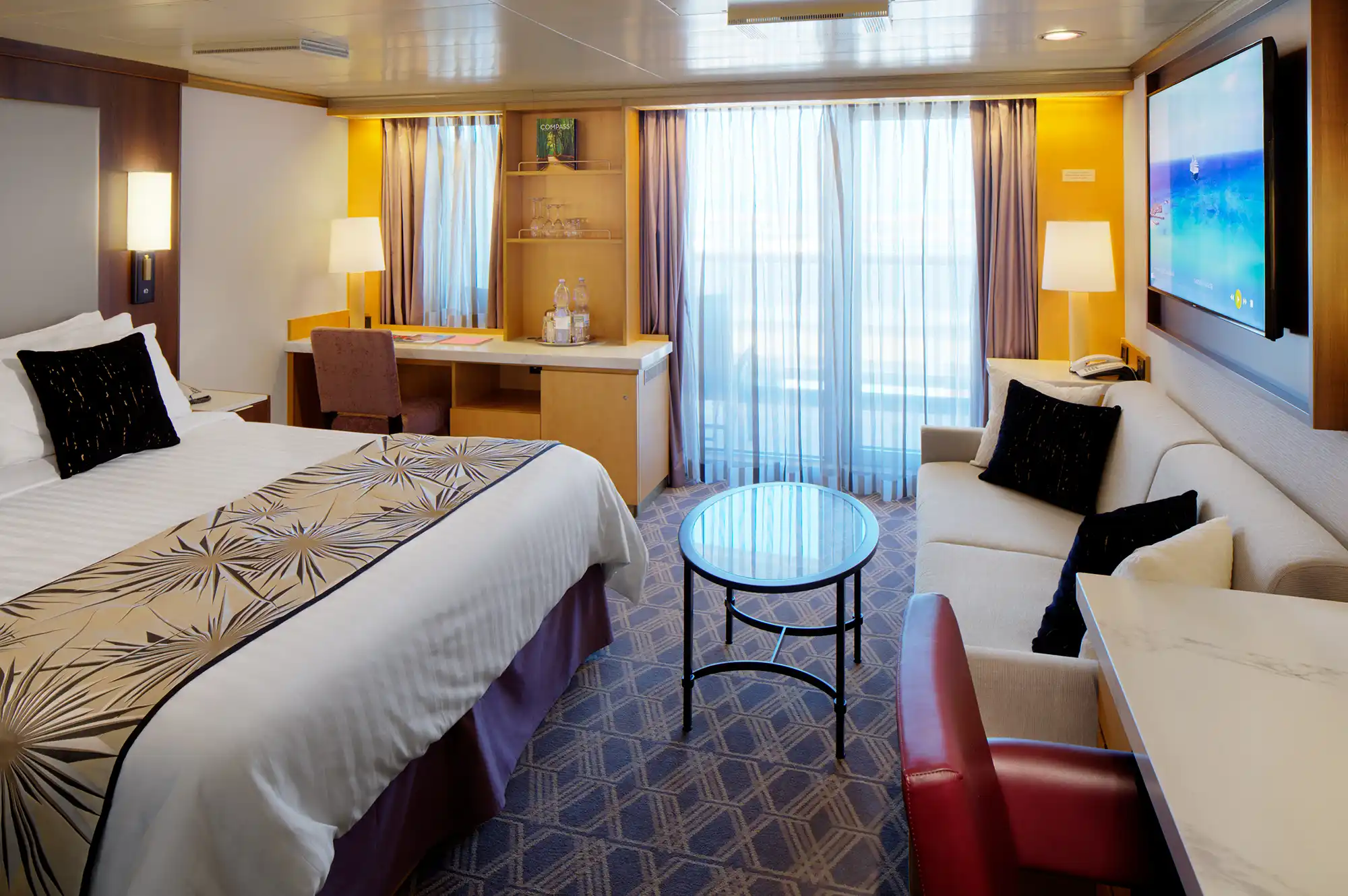 A well-appointed, modern guest bedroom on the Holland America Westerdam.