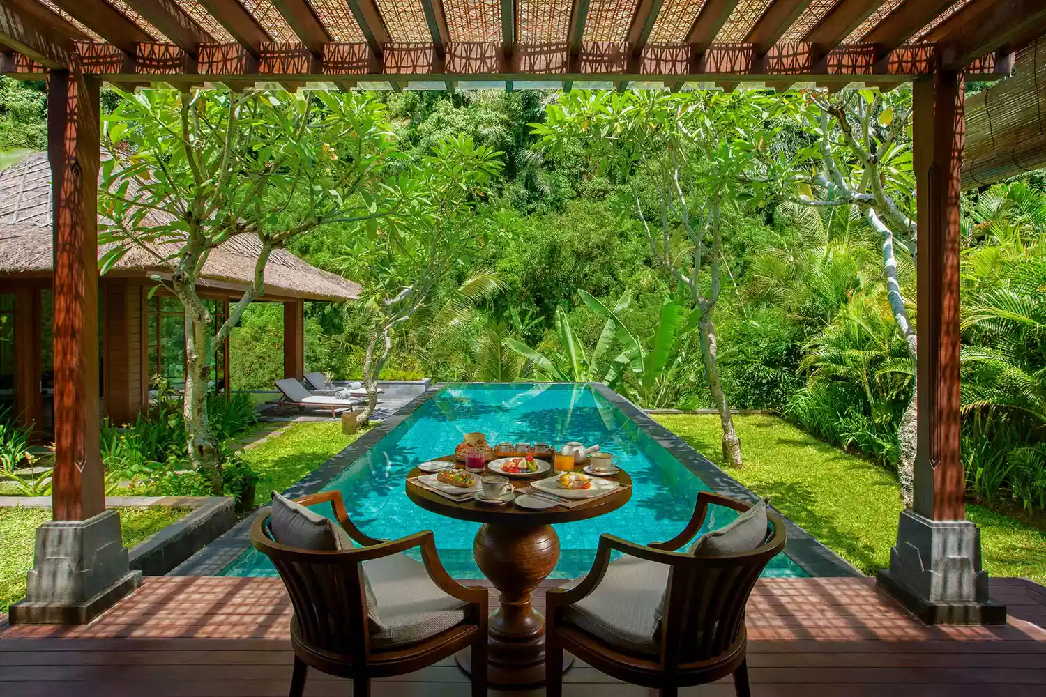Serene swimming pool area at Mandapa, a Ritz-Carlton Reserve