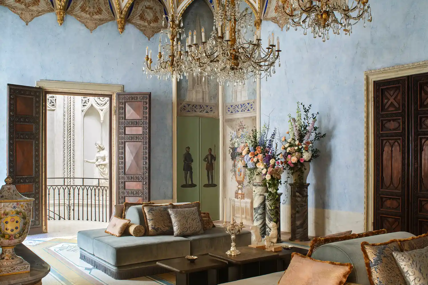 The Sala della Cultura featuring sofas and a balcony overlooking Venice.