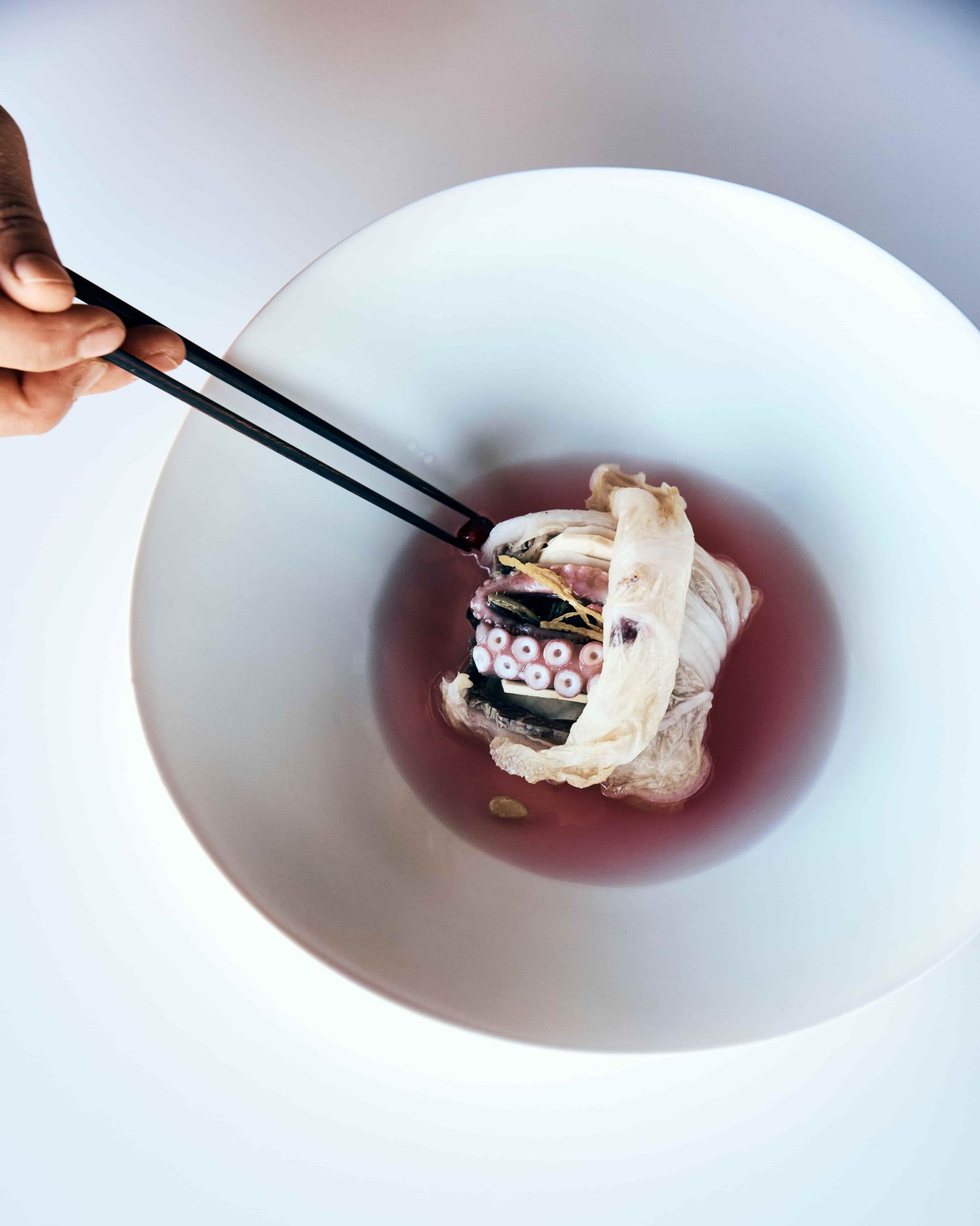 Close-up of a sophisticated fine dining dish with traditional Korean plating elements.