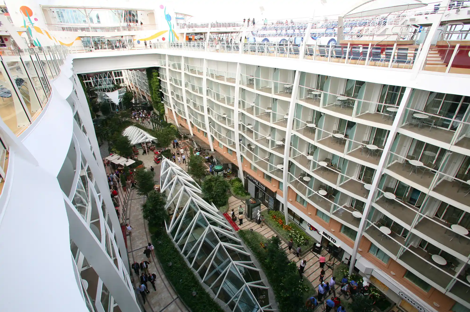 View from above overlooking the Central Park neighborhood on Allure of the Seas with greenery and balcony cabins.