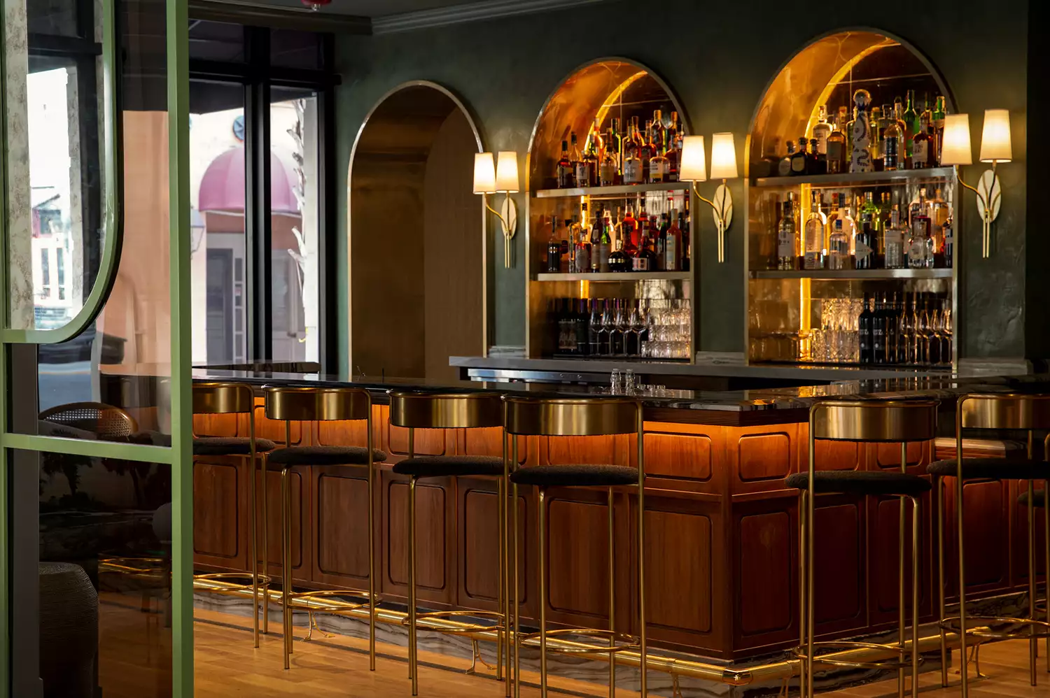 Elegant lobby bar featuring velvet seating and gold accents.