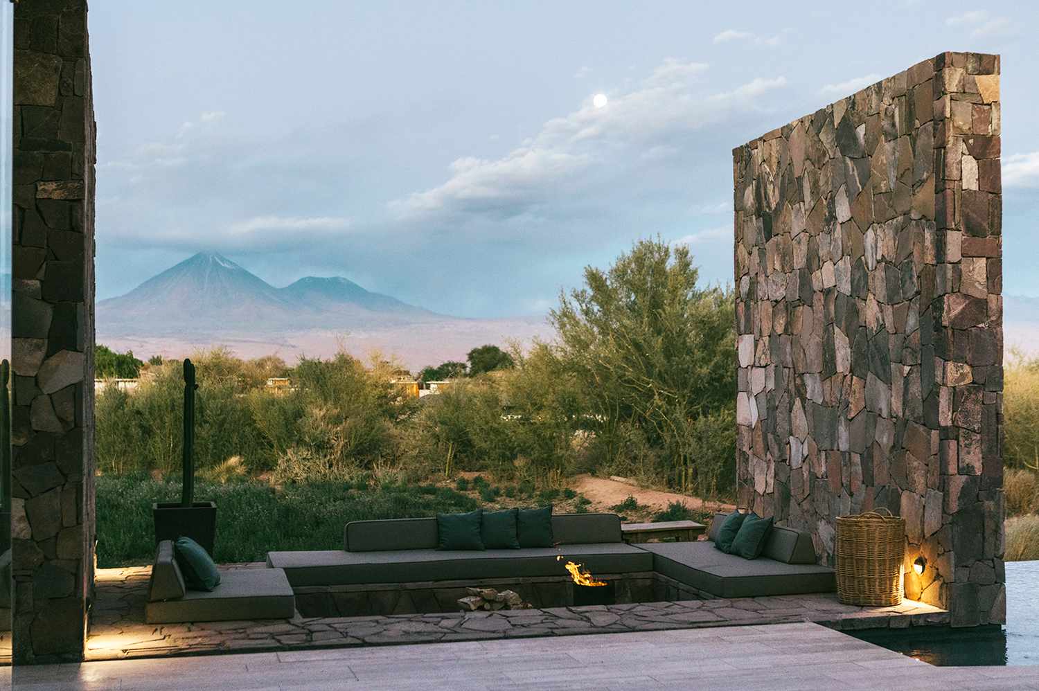 Wide shot of a contemporary luxury lodge architecture in a remote setting.