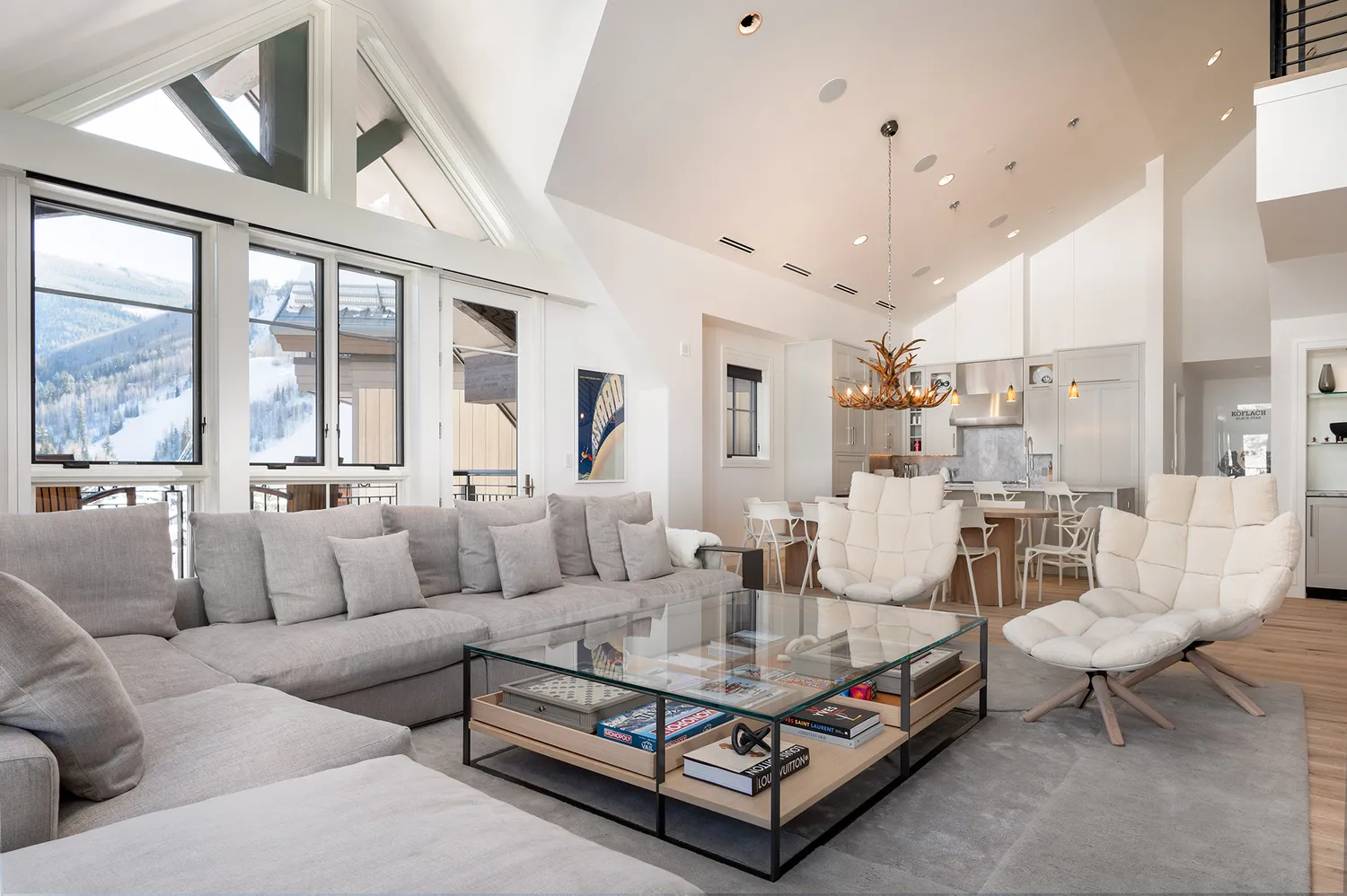 Modern luxury living room at Solaris Residences in Vail, Colorado with mountain-facing windows.