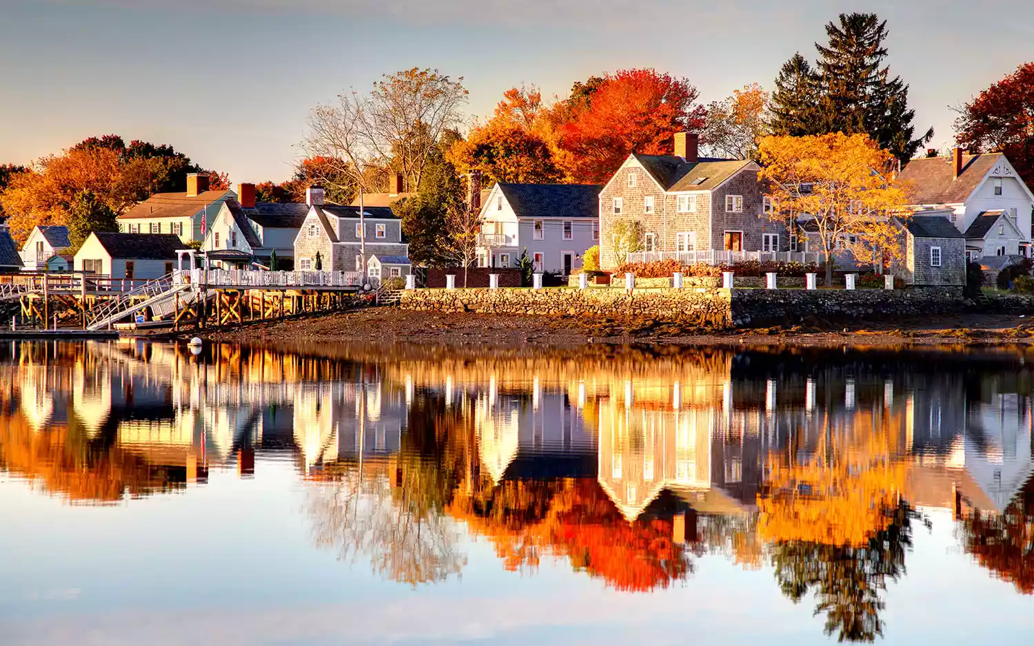 An aerial view of the historic brick buildings and harbor of Portsmouth, New Hampshire in autumn.