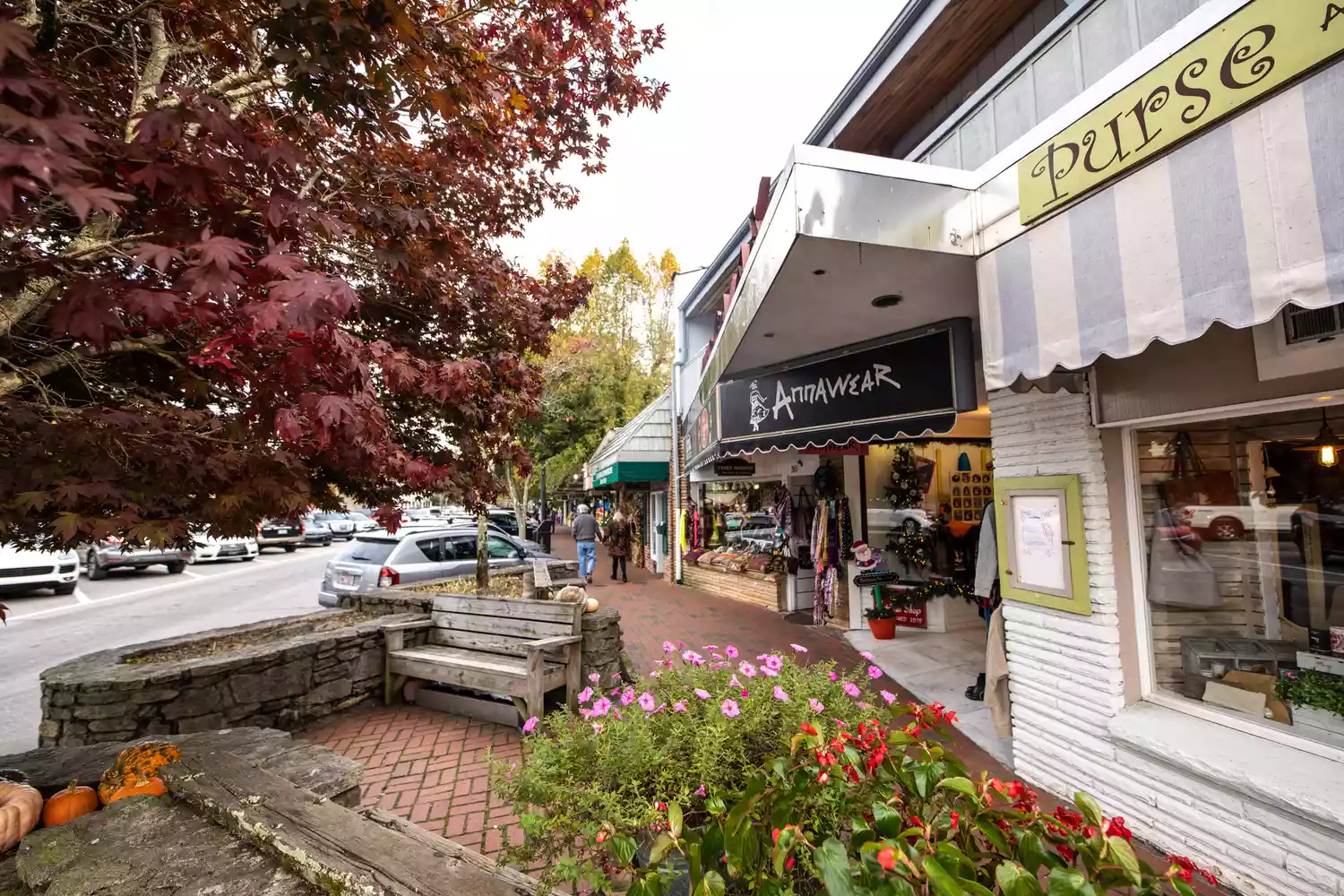 Front view of luxury boutiques and shops in downtown Highlands, NC.