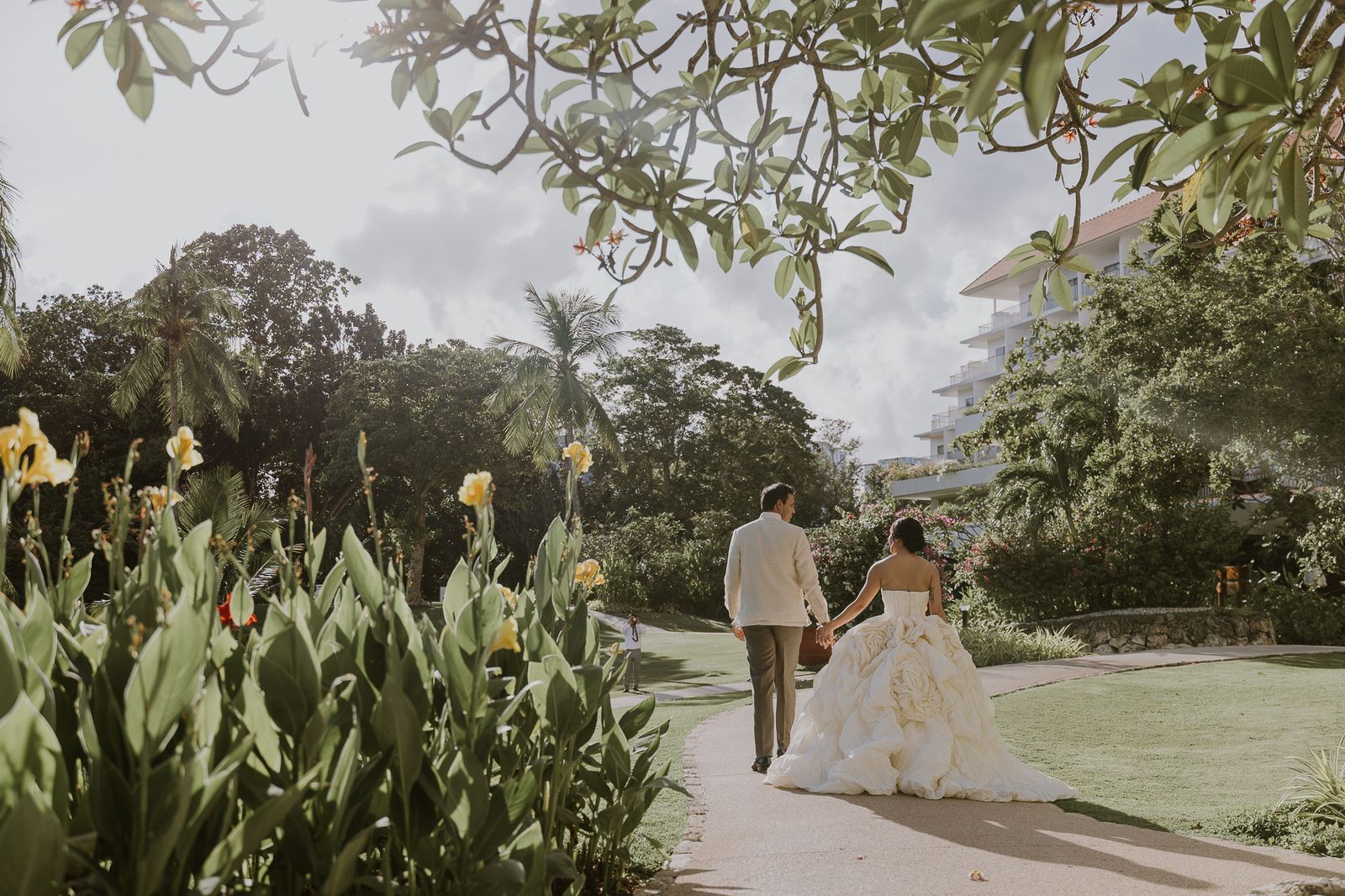 Close-up of a couple holding hands during a wedding ceremony in the Philippines.