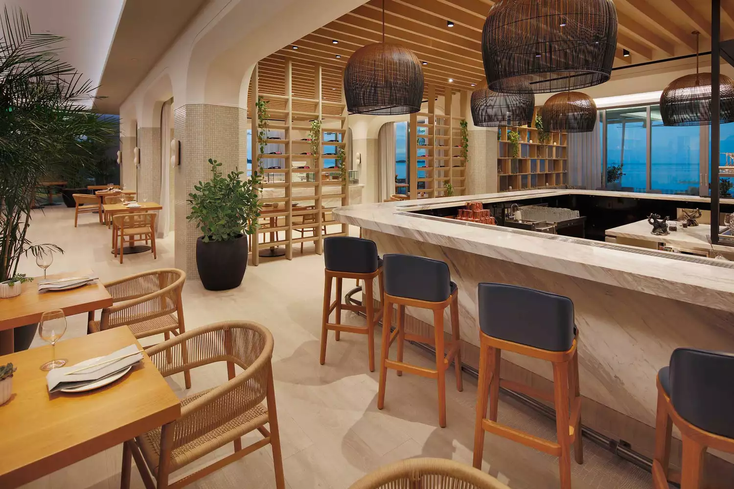 The contemporary dining room and bar area at OIA Restaurant.