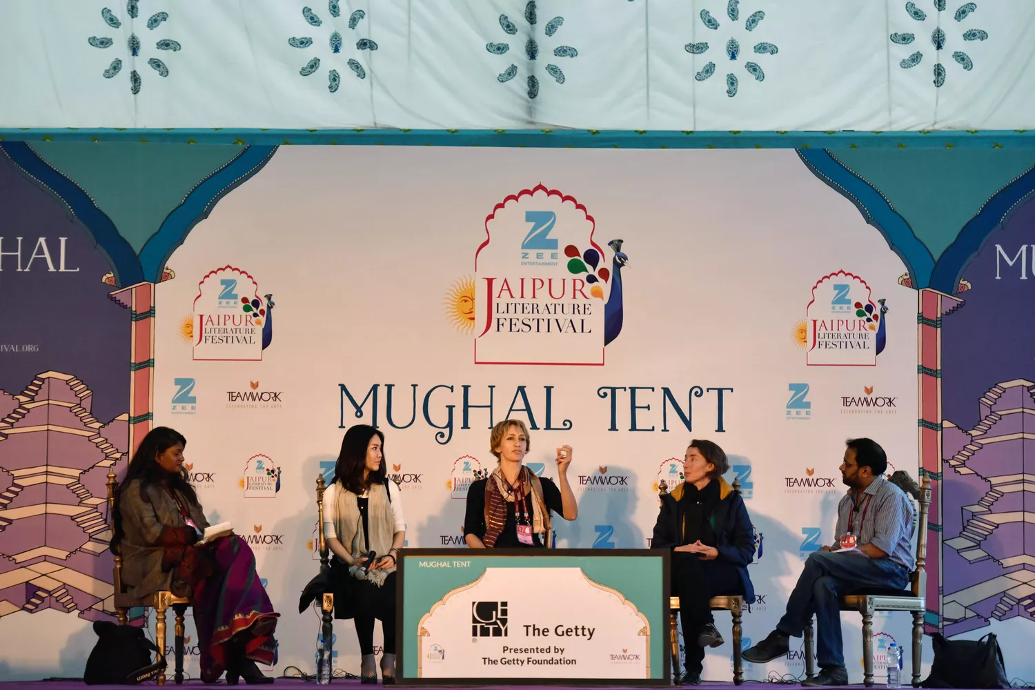 A panel of speakers discussing literature during a session at the Jaipur Literature Festival.