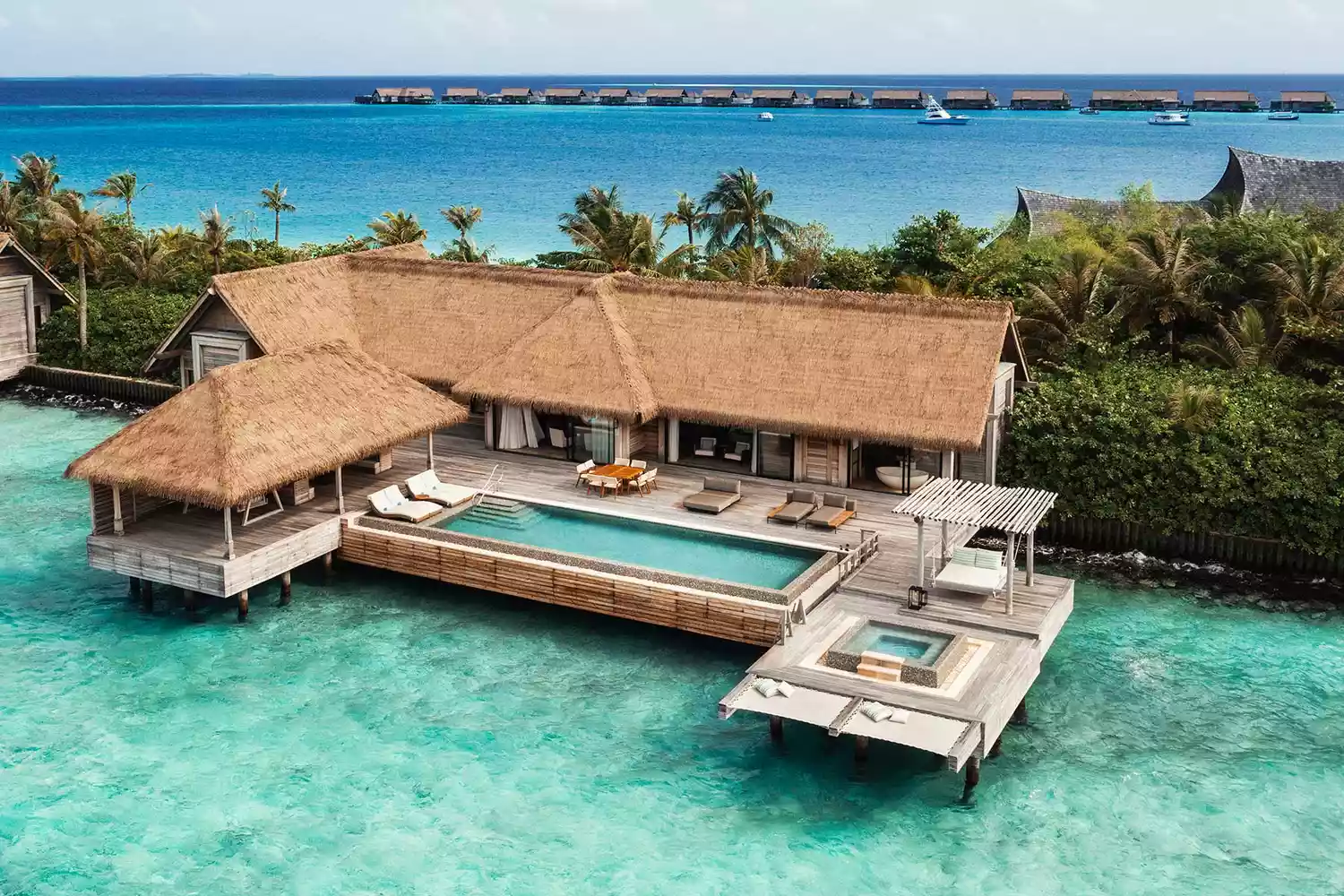 The architectural beauty of the Waldorf Astoria Maldives Ithaafushi villas over the ocean.