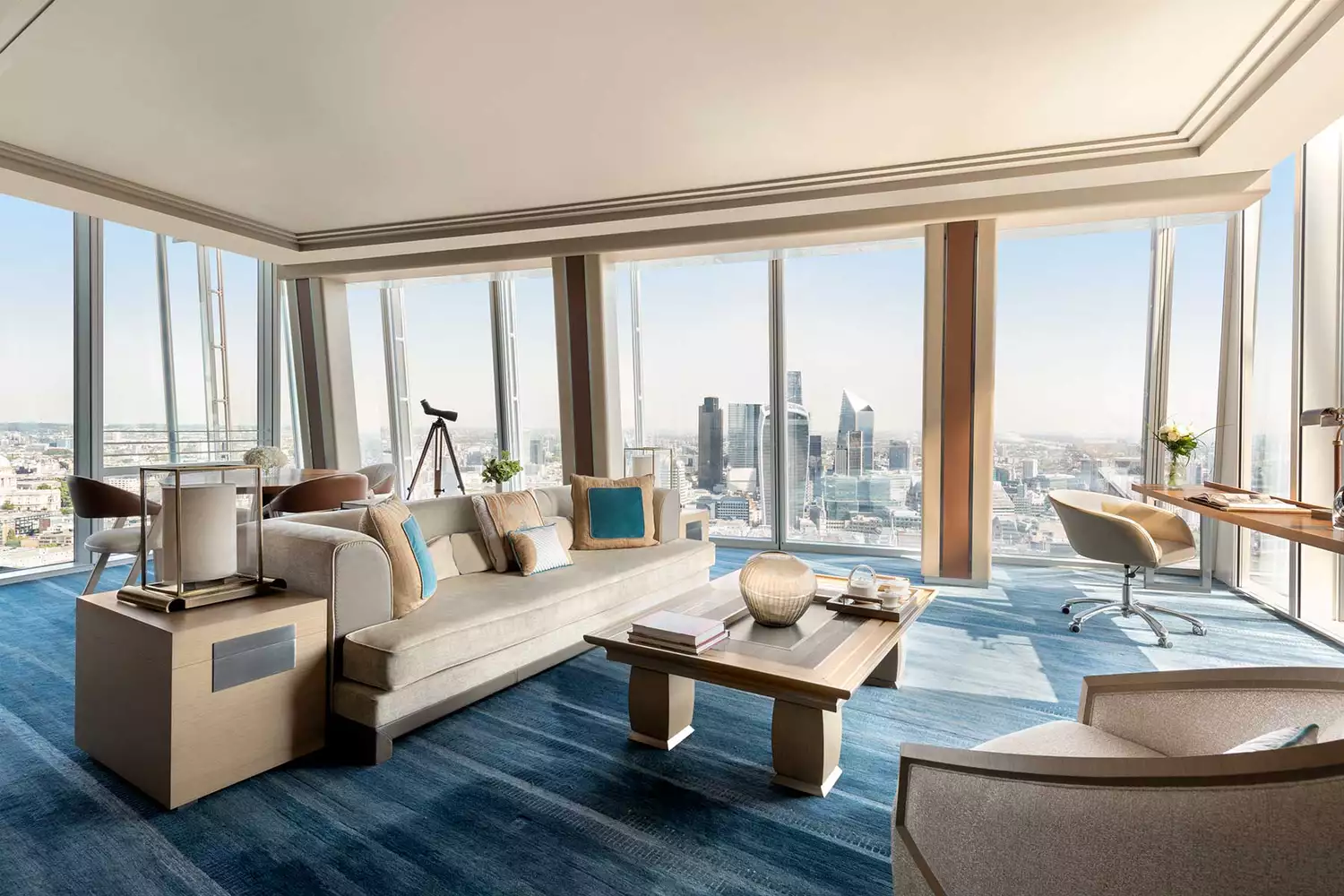 Sleek living room featuring city views at Shangri-La The Shard, London.