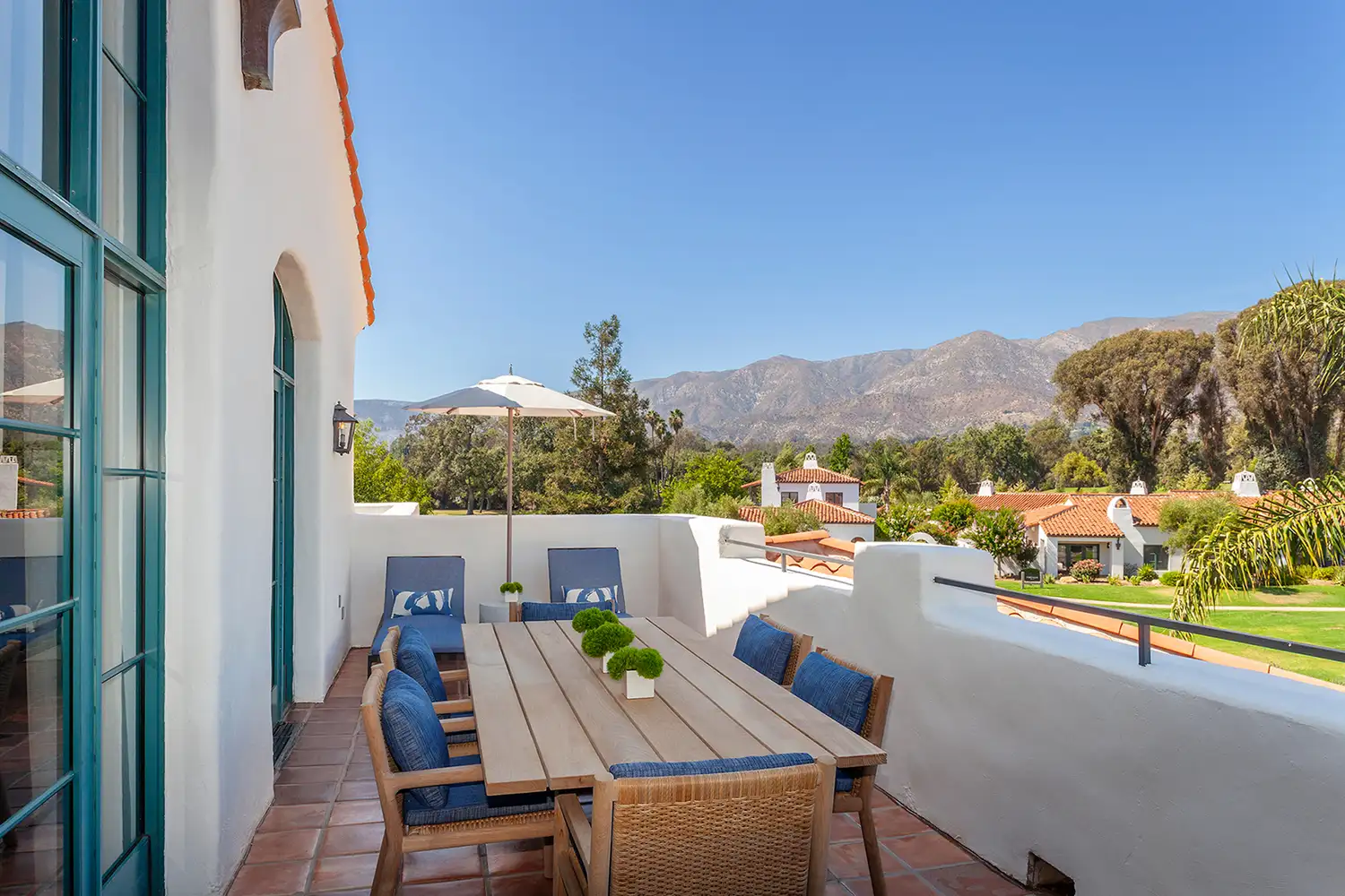 A private luxury terrace overlooking the landscaped grounds and distant mountains of Ojai.