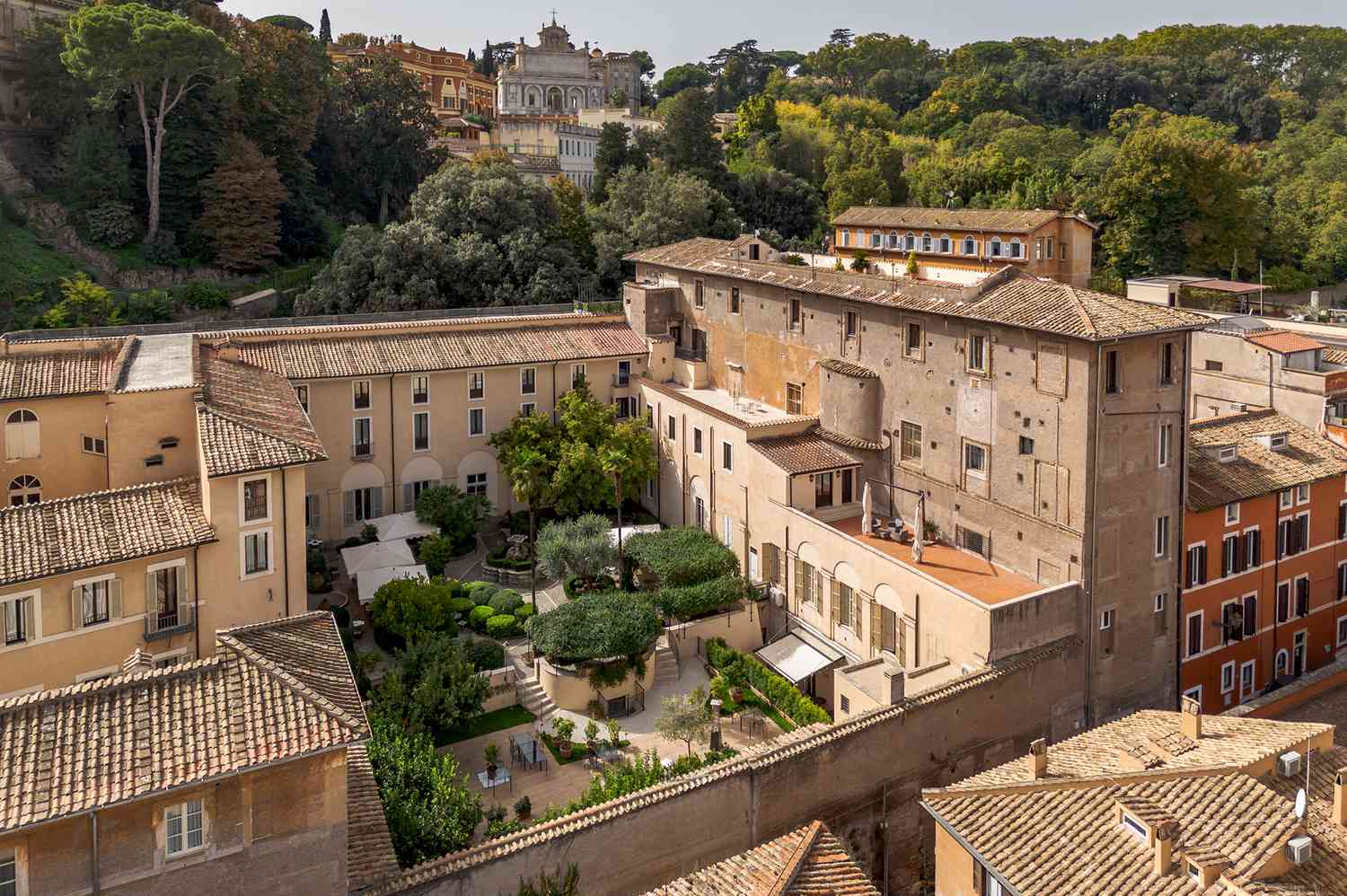 The historic stone exterior and Baroque architecture of Donna Camilla Savelli in Trastevere.