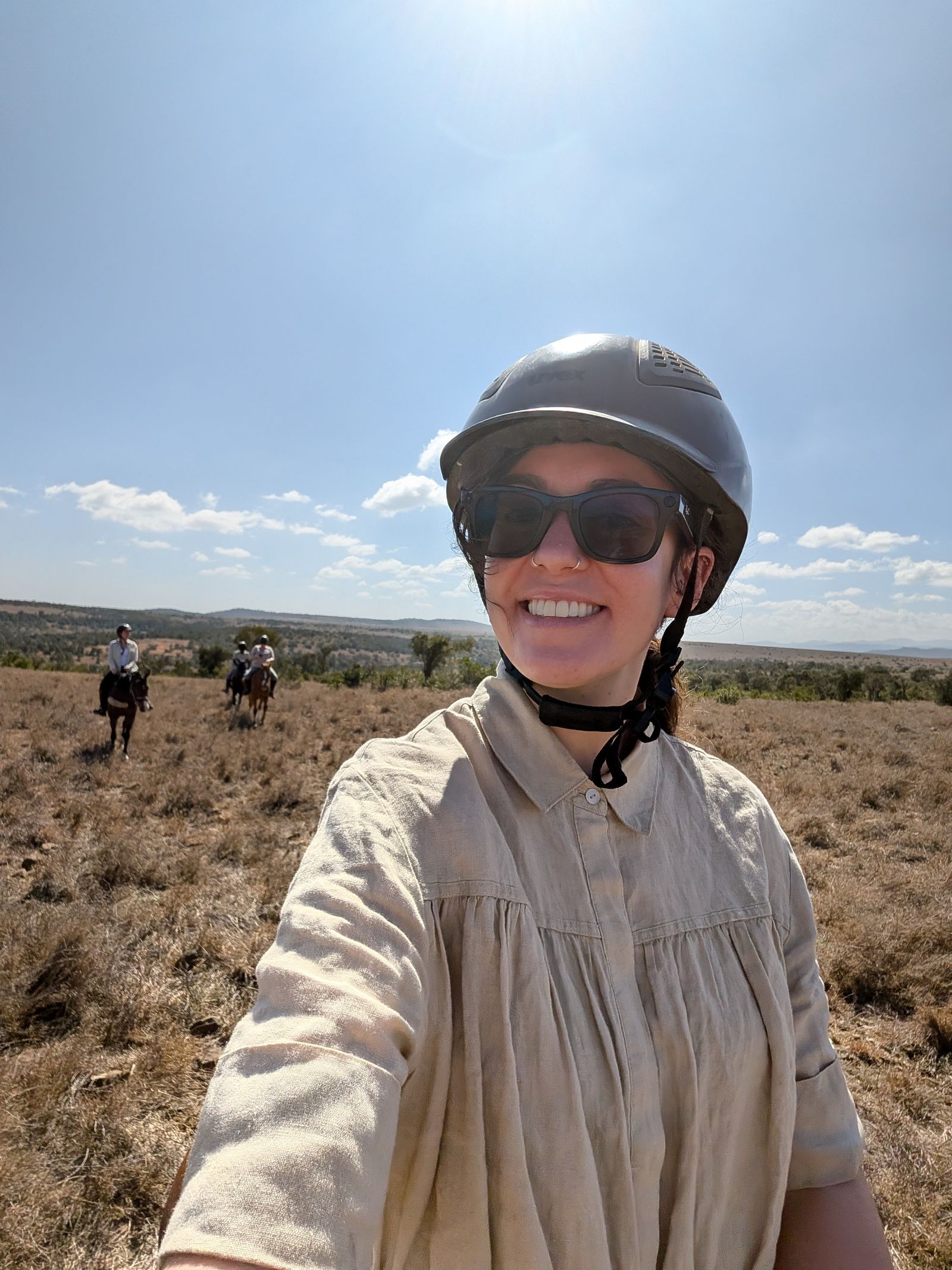 A traveler wearing protective gear looking out at the sky.