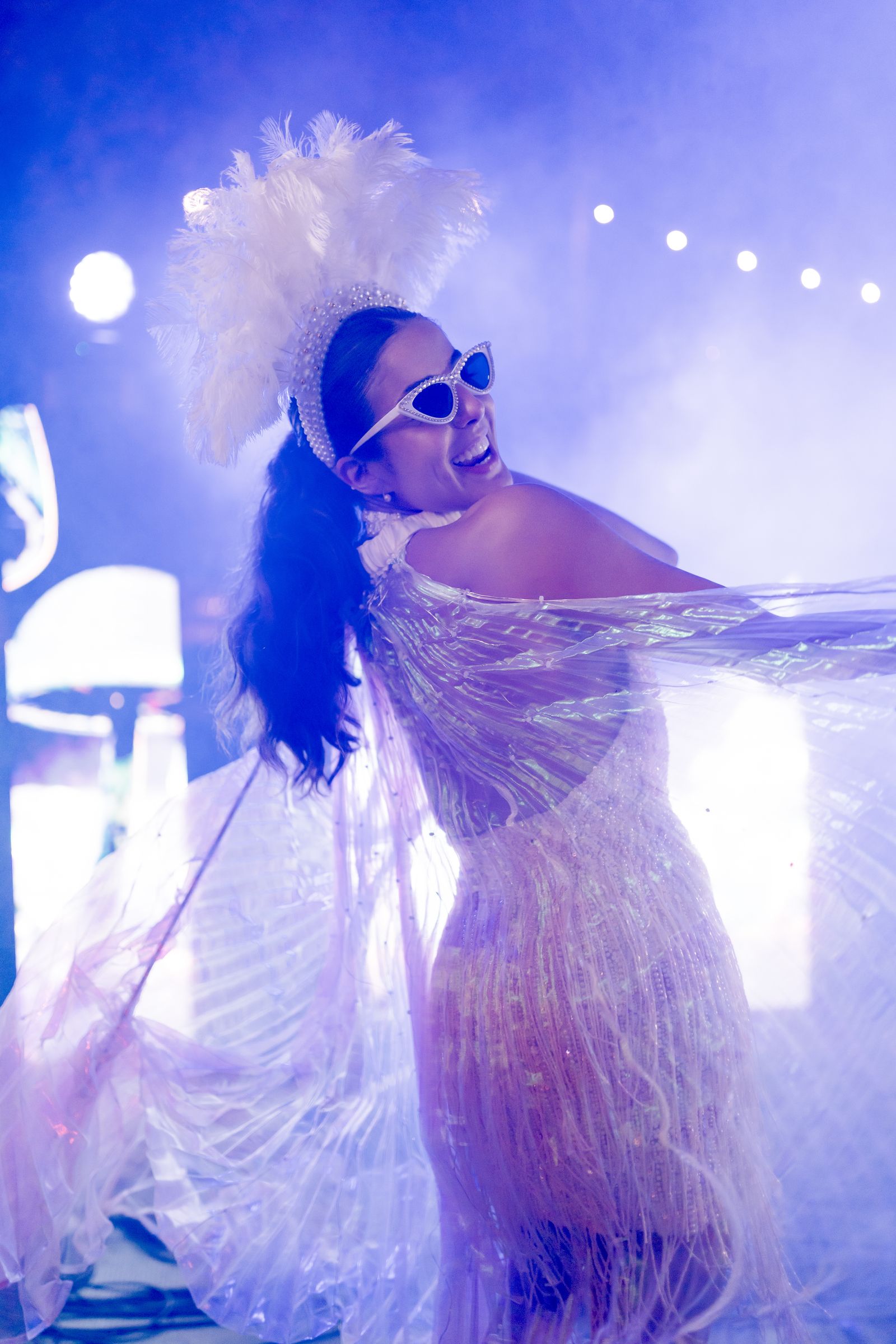 A performer dancing during a celebratory wedding event.