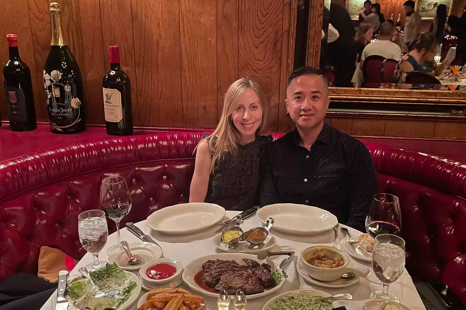 A couple enjoying a dinner date together at a restaurant.