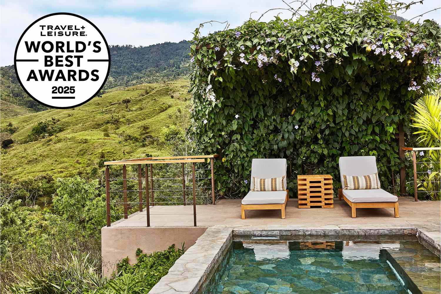 A scenic view of a boutique luxury resort in a tropical rainforest setting.