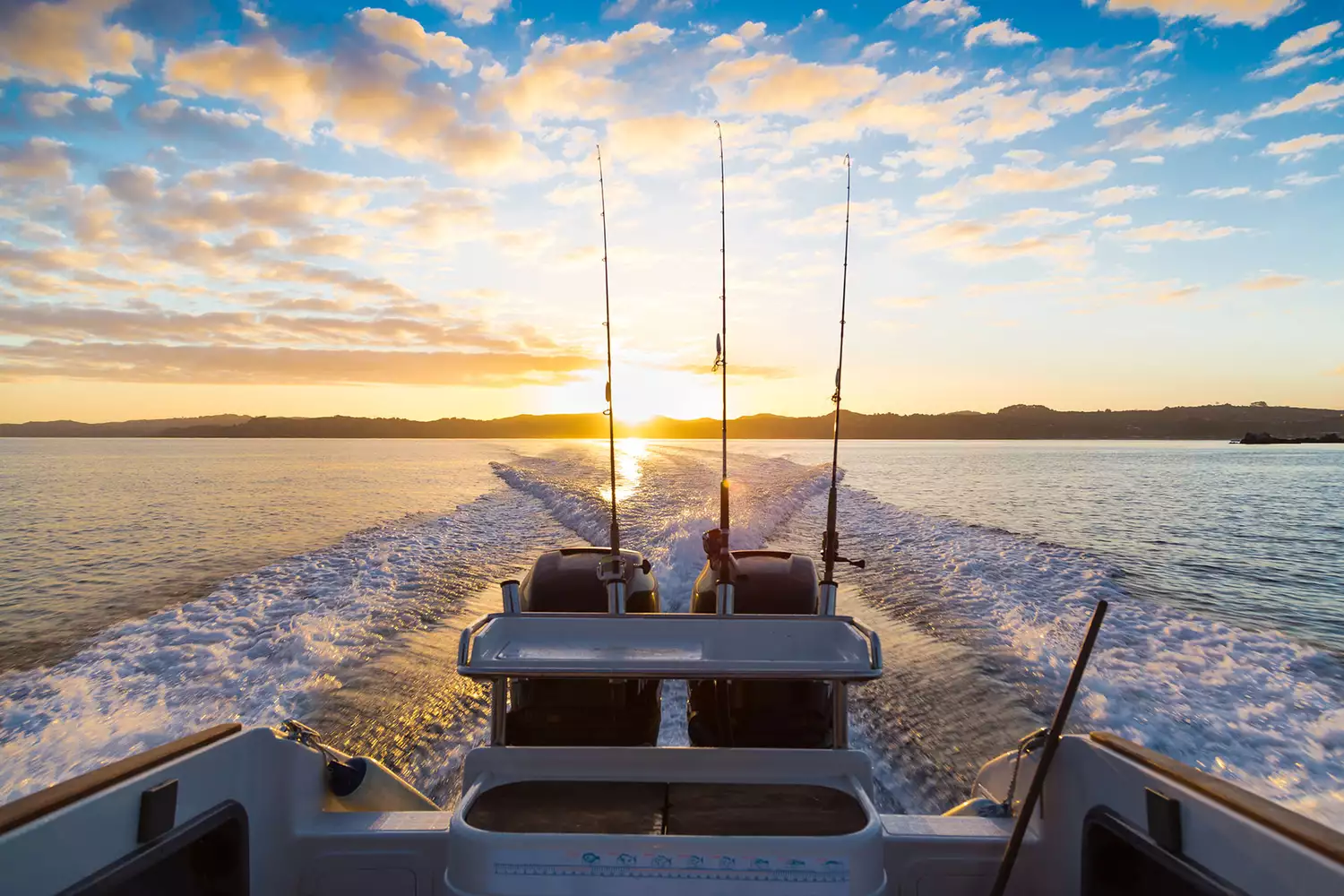 Golden sunrise over calm waters in the Hauraki Gulf near Waiheke.