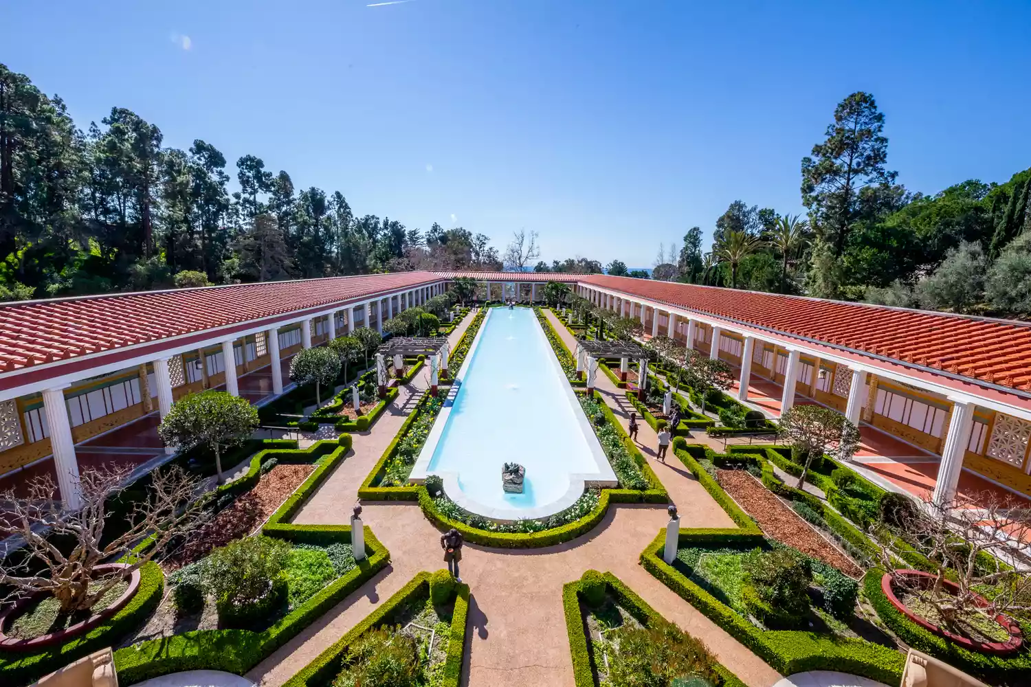 A lush, Roman-inspired courtyard garden with a long reflecting pool at the Getty Villa.