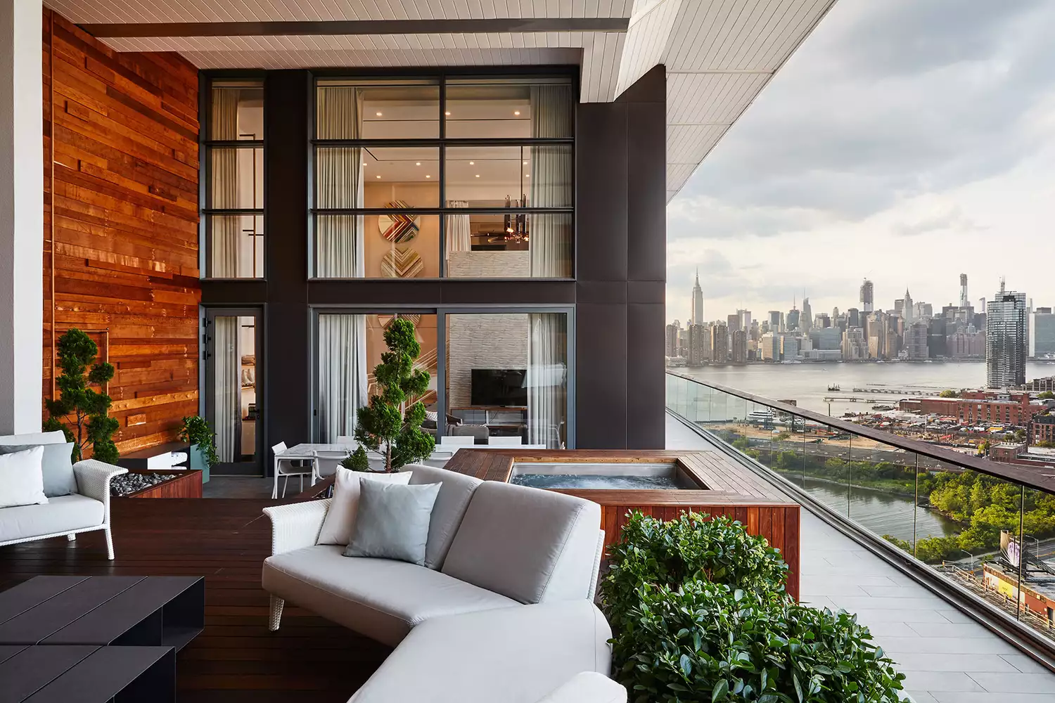 Panoramic view of the New York City skyline and East River from a balcony at The William Vale.