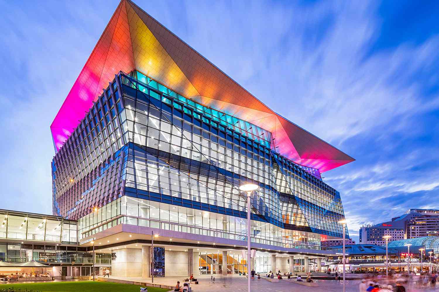 A vibrant public gathering during Sydney WorldPride 2023 featuring festive colors.