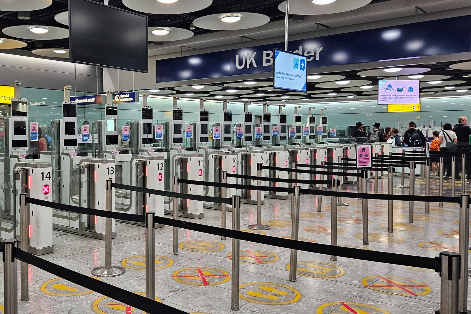 Close-up of an automated ePassport gate monitor and scanning hardware at an airport terminal.