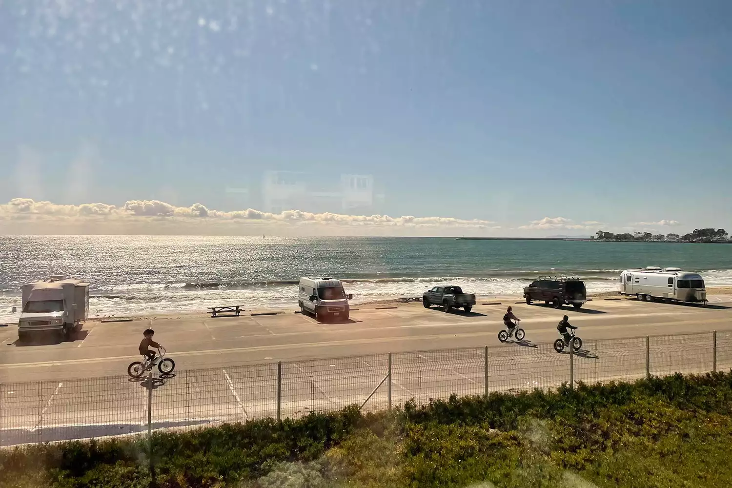 A view of Capistrano Beach seen through the window of an Amtrak Pacific Surfliner train.
